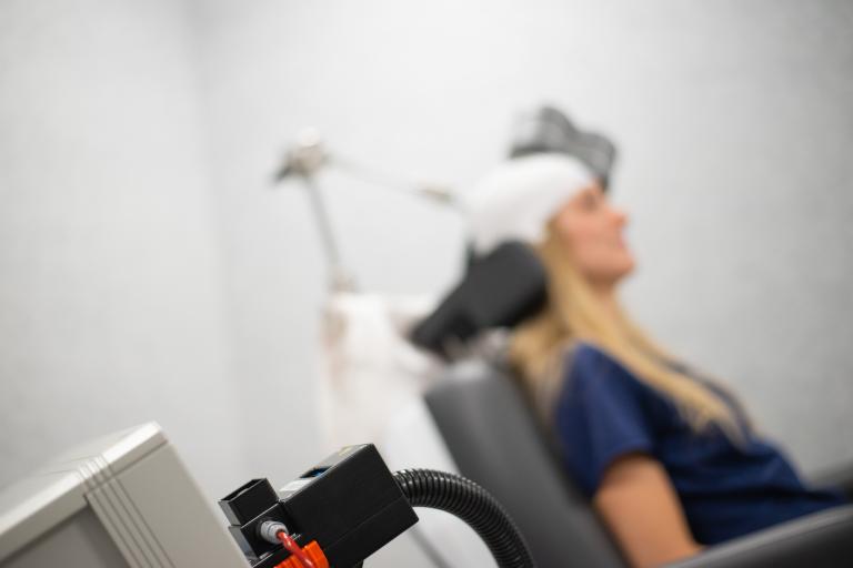 person in tms machine
