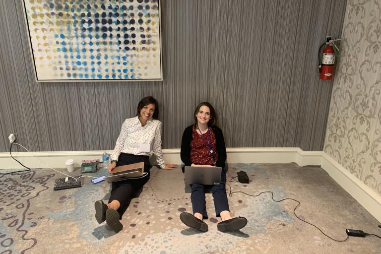 two women sitting on the floor