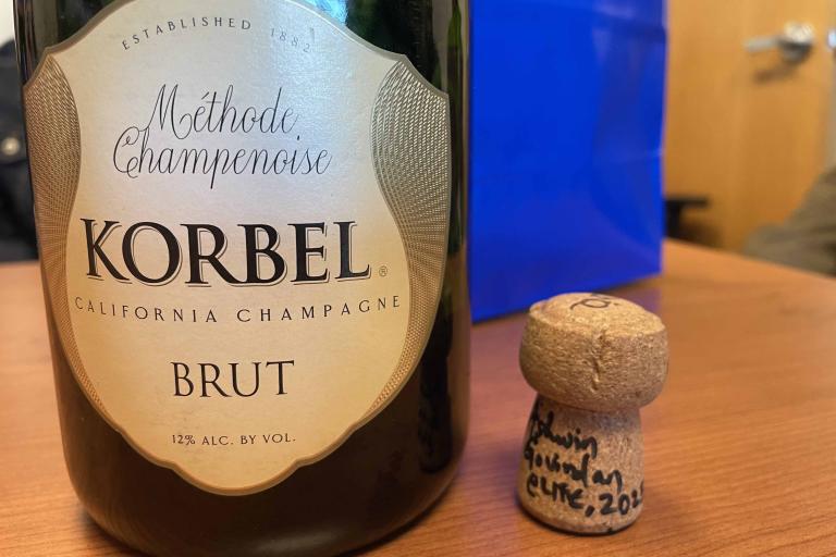 Champagne bottle with cork signed by Ashwin Govindan