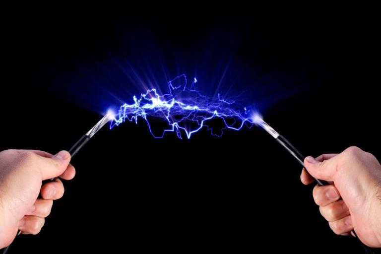 Purple electricity between two hands 
