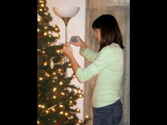 Nicole trimming the holiday tree