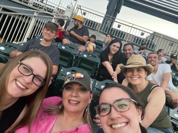 large group of people posing for picture