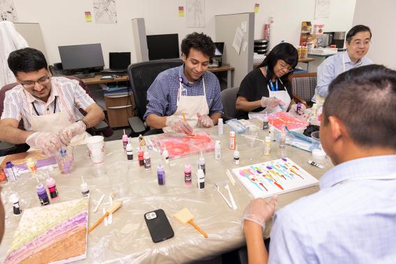 CMRU members working on abstract painting during a team-building activity