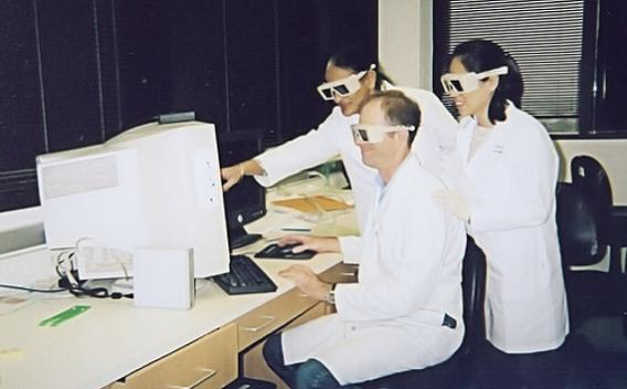 Group of people using glasses to look at computer