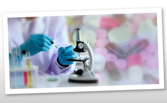 researcher in gloves places dropper on slide with microscope in foreground