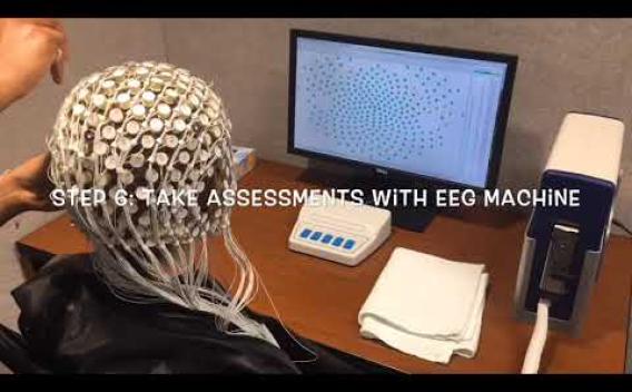 research participant with EEG viewing computer