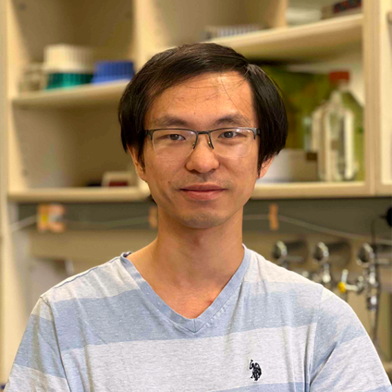 Dan Tong lab member, Jack Zhou standing in the lab