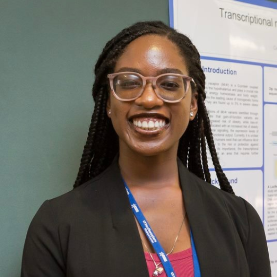  a woman with long braids, wearing glasses