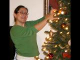 Kat trimming the Christmas tree