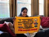 Aparna's going away party. Aparna with gift to make her popular in her new city! (Terrible Towel)