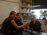 Three team members sharing a champaign toast