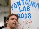 Neal poses by an autographed Dry Erase Board of Fame – circa 2008.
