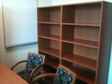 Chairs, table and bookshelves in New Office
