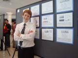 Patrick standing in front of his poster