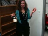Sarah holding a bottle of champaign