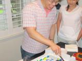 Tony Hsieh Going Away Party - cutting cake