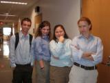 Four Lab team  members poses in hallway