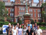 2010 Lab Group in front of large, red brick building
