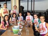 Lab team at going away lunch for Peng Shuo, 2014, wearing crab bibs