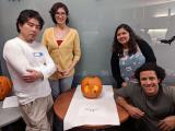 Lab members and pumpkin carved with kidneys