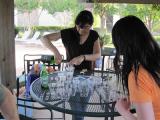 Two team members pouring drinks at pool party