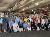 large group of people posing for picture