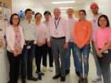 9 lab members posed in the lab.