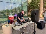 Dr. Dellinger working with his DJ equipment outside of UTSW