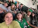 Lab members enjoying a Dallas Stars hockey game.