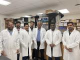 seven members of the Poojary research lab standing in the lab