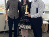 Dr. Sam Pappas and Dr. Bill Dauer celebrate with Caitlin Leedy after her successful dissertation defense.