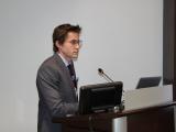 Urogynecology and Reconstructive Pelvic Surgey Fellow, Dr. Frank Jefferson during his presentation at a podium