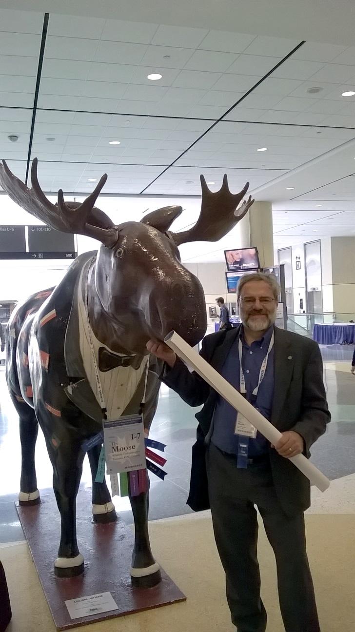 Ralph Mason with a moose statue