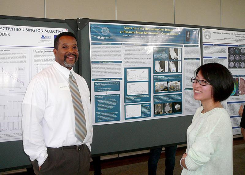 Derek White with research poster