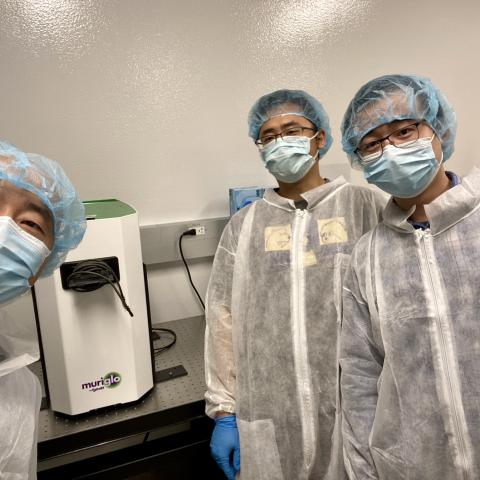 Lab team in PPE working on MuriGlo