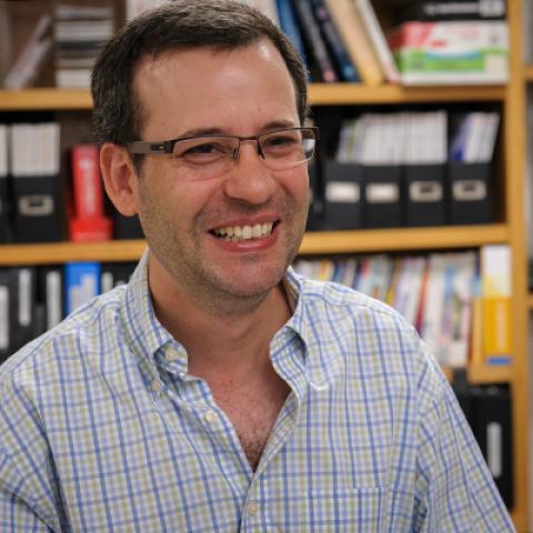 Dr. Ezra Burstein in his lab in casual attire