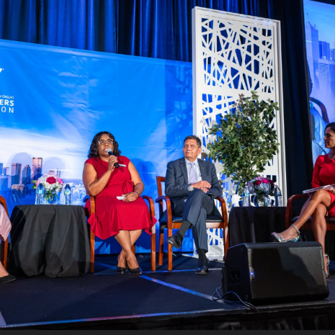 four presenters on a stage