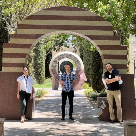 Three people posing for a picture