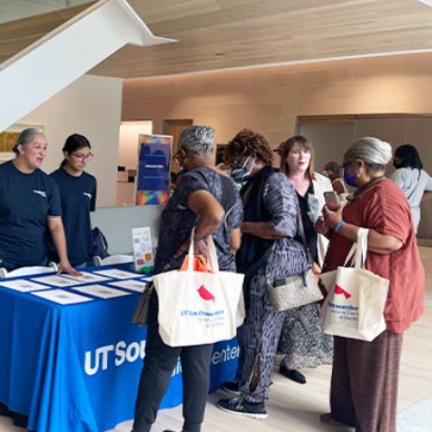 attendees at a booth