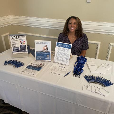 woman at a conference booth