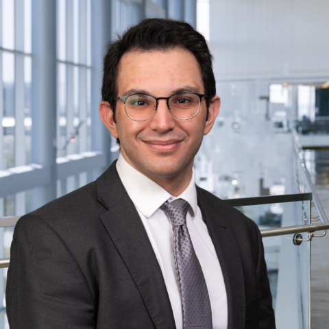 Dr. Ahmad Anouti wearing a dark gray suit in the lobby of Clements University Hospital